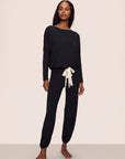 Model is wearing Gisele TENCEL™ Modal Slouchy PJ Set in Black/Ivory
