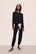 Model is wearing Gisele TENCEL™ Modal Slouchy PJ Set in Black/Ivory