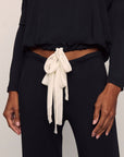 Model is wearing Gisele TENCEL™ Modal Slouchy PJ Set in Black/Ivory