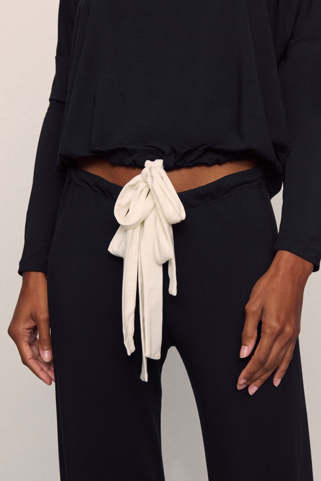 Model is wearing Gisele TENCEL™ Modal Slouchy PJ Set in Black/Ivory
