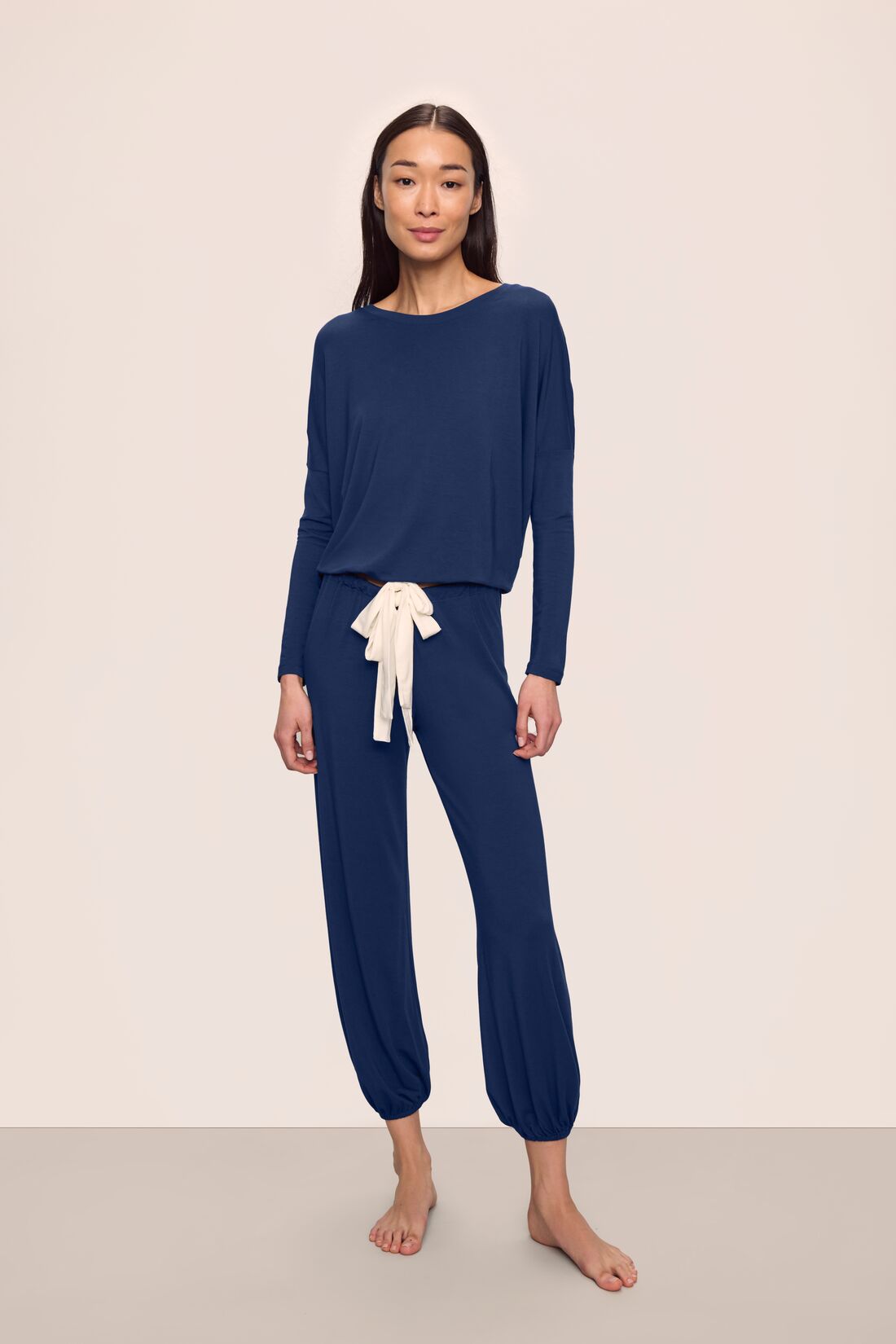 Model is wearing Gisele TENCEL™ Modal Slouchy PJ Set in Navy/Ivory