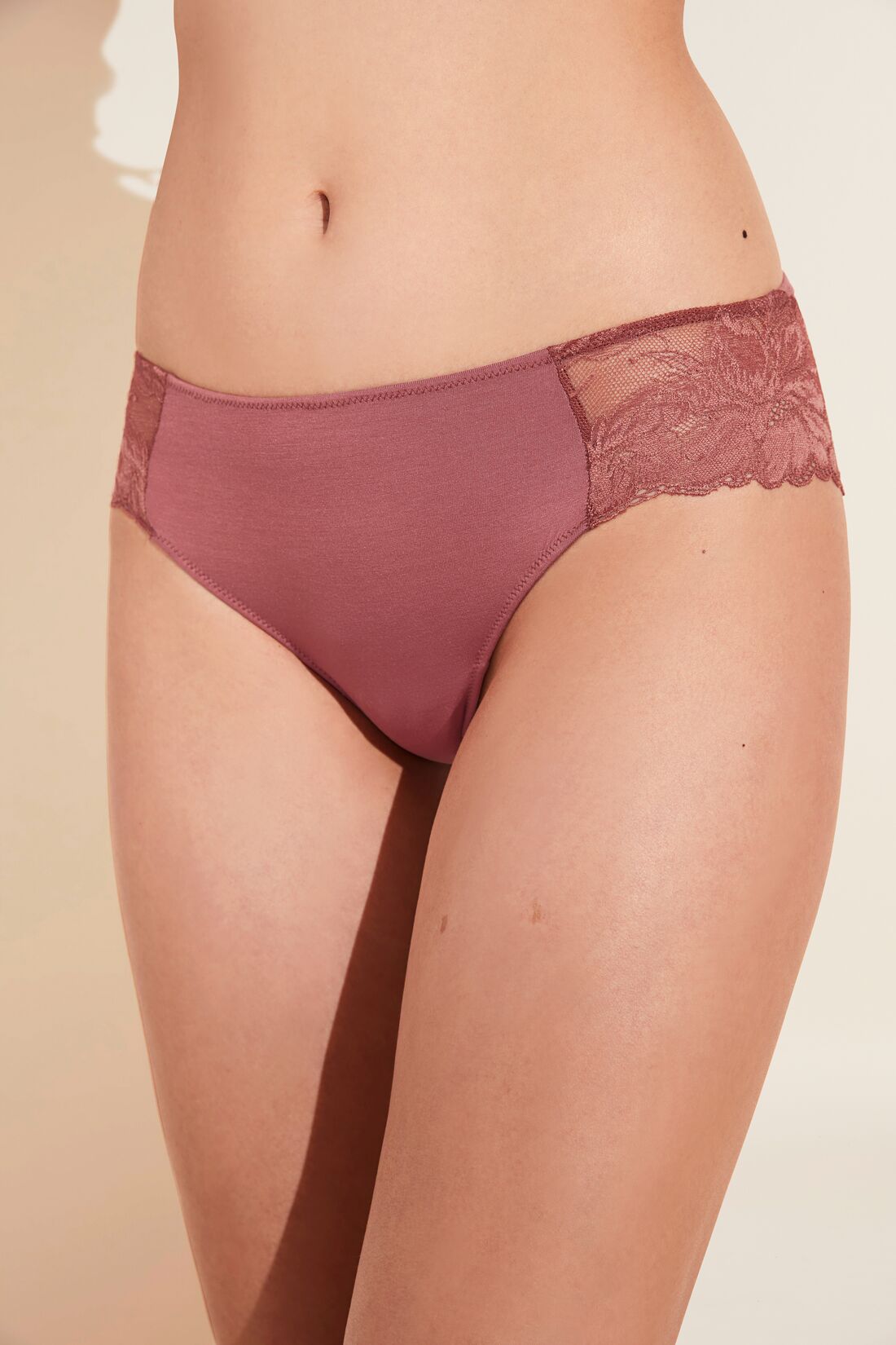 Model wears the Rosalia TENCEL™ Modal Bikini in Rosewood.