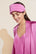 Model wears Inez Washable Silk Eye Mask in Italian Rose.