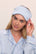 Model is wearing Washable Silk Eye Mask in Powder Blue