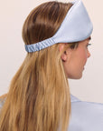Model is wearing Washable Silk Eye Mask in Powder Blue