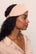 Model is wearing Washable Silk Eye Mask in Rose Cloud