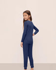 Model is wearing Kids TENCEL™ Modal Unisex Long PJ Set in Navy/Ivory