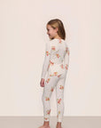 Model is wearing Kids Printed TENCEL™ Modal Unisex Long PJ Set in Floral Bloom Ivy/Vanilla Cream