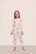 Model is wearing Kids Printed TENCEL™ Modal Unisex Long PJ Set in  Floral Bloom Ivy/Vanilla Cream
