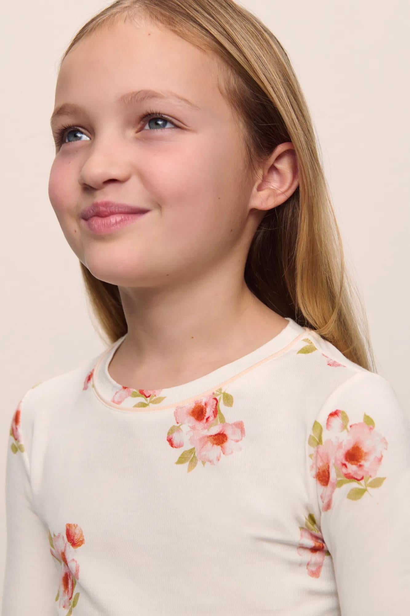 Model is wearing Kids Printed TENCEL™ Modal Unisex Long PJ Set in  Floral Bloom Ivy/Vanilla Cream