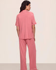 Model is wearing Gisele TENCEL™ Modal Short Sleeve & Pant PJ Set in Sunkissed Coral/Ivory