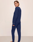 Model is wearing Gisele TENCEL™ Modal Crew Neck PJ Set in Navy/Ivory