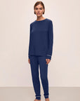 Model is wearing Gisele TENCEL™ Modal Crew Neck PJ Set in Navy/Ivory