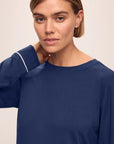 Model is wearing Gisele TENCEL™ Modal Crew Neck PJ Set in Navy/Ivory