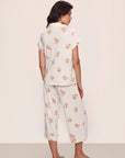 Model is wearing Gisele Printed TENCEL™ Modal Short Sleeve Cropped PJ Set in Floral Bloom Ivy/Vanilla Cream