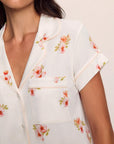 Model is wearing Gisele Printed TENCEL™ Modal Short Sleeve Cropped PJ Set in Floral Bloom Ivy/Vanilla Cream