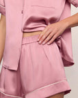 Model is wearing Inez Washable Silk Short PJ Set in Lilas/Ivory