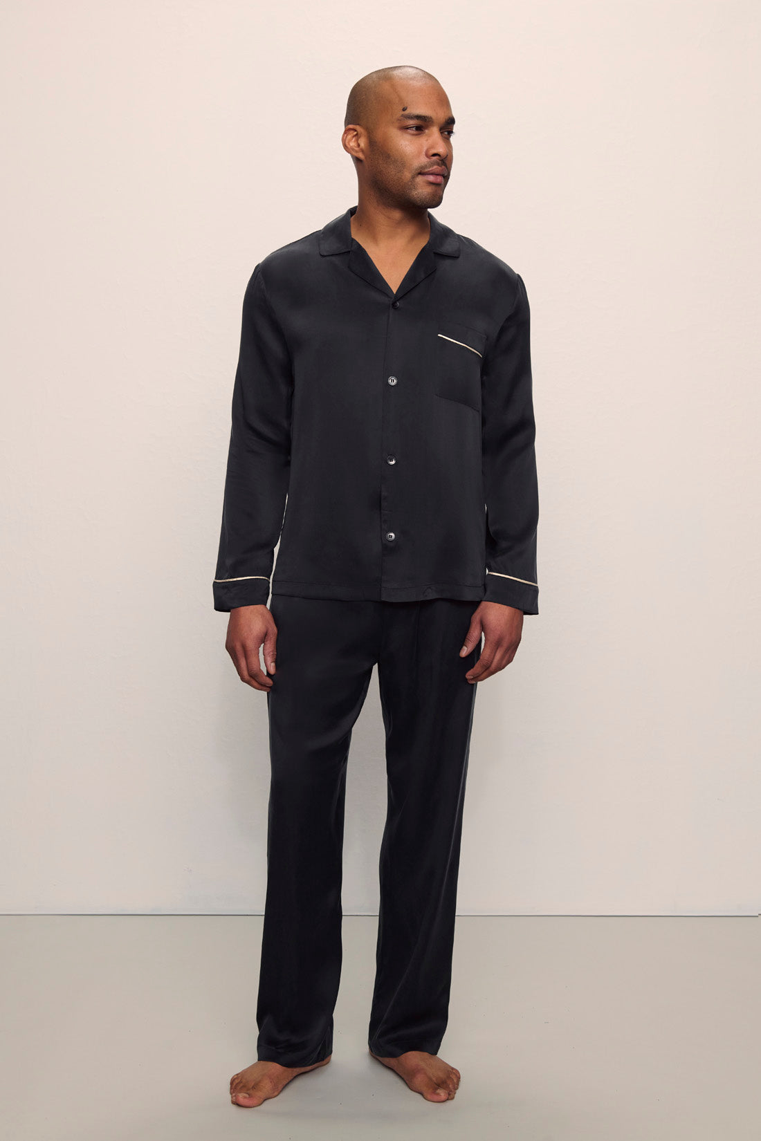 Model is wearing Charles Washable Silk Long PJ Set in Black/Champagne