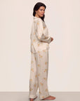 Model is wearing Inez Washable Silk Printed Long PJ Set in Floral Bloom Peach Dust/Ivory