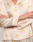 Model is wearing Inez Washable Silk Printed Long PJ Set in Floral Bloom Peach Dust/Ivory