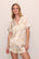 Model is wearing Inez Washable Silk Printed Short PJ Set in  Floral Bloom Peach Dust/Ivory