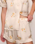 Model is wearing Inez Washable Silk Printed Short PJ Set in Floral Bloom Peach Dust/Ivory