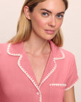 Model is wearing Frida TENCEL™ Modal Shortie Short PJ Set in Sunkissed Coral/Ivory