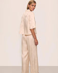 Model is wearing Inez Washable Silk Jacquard Relaxed Wide Leg Pant PJ Set in Floral Vine Peach Dust