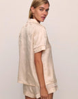 Model is wearing Inez Washable Silk Jacquard Short PJ Set in Floralvine Peachdust/Palemauve
