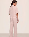 Model is wearing Nautico Relaxed Short Sleeve & Pant PJ Set in Feeder Stripespale Mauve/White