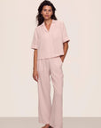 Model is wearing Nautico Relaxed Short Sleeve & Pant PJ Set in Feeder Stripespale Mauve/White