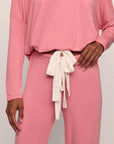 Model is wearing Gisele TENCEL™ Modal Slouchy PJ Set in Sunkissed Coral/Ivory
