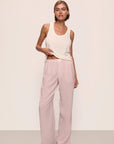 Model is wearing Nautico Boxer Pant in Feeder Stripespale Mauve/White