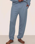 Model is wearing Mens French Terry Jogger in Faded Denim